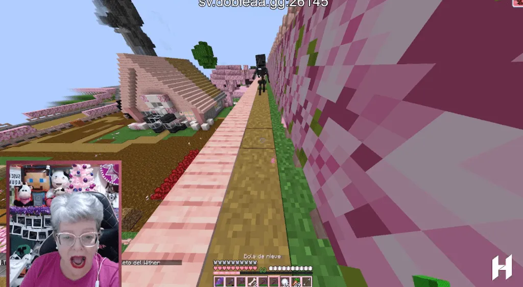 Fanny Buelmo, or Aqumadre, is an older women gamer and streamer on Twitch. In this image, she is playing Minecraft.